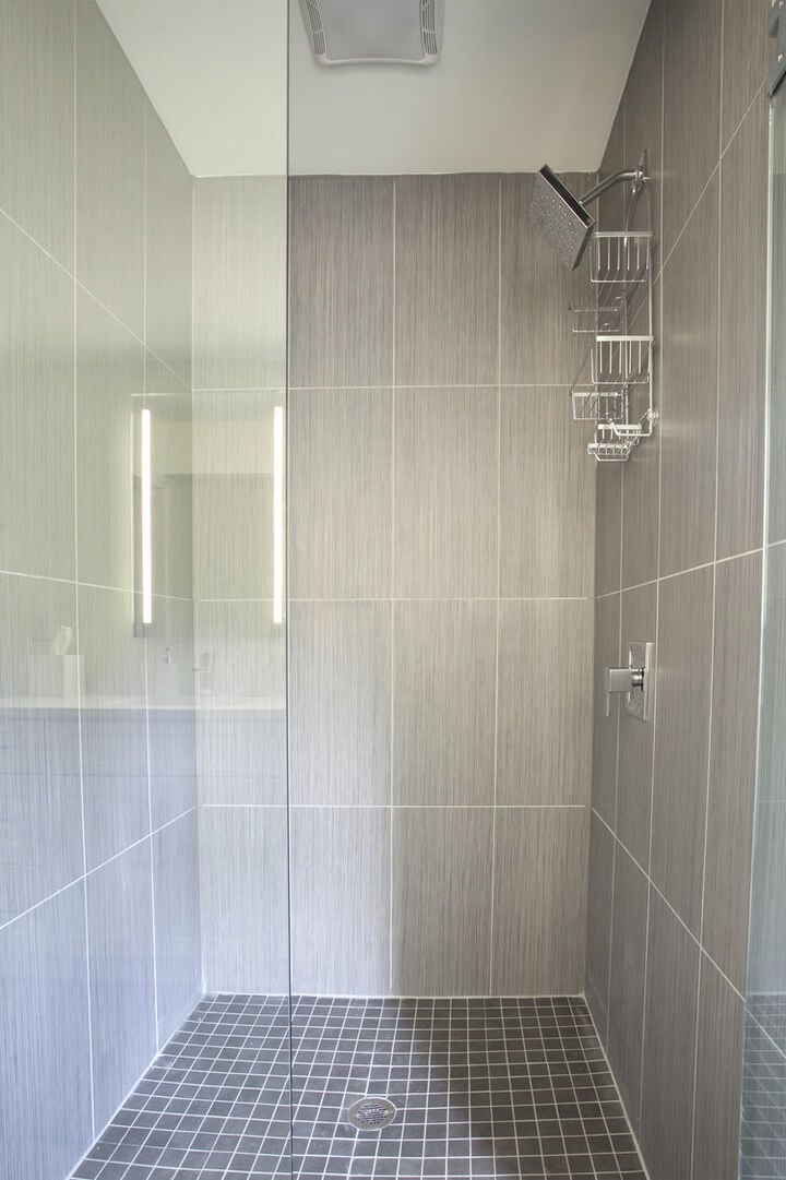 Walk-In Shower with Glass Door.
