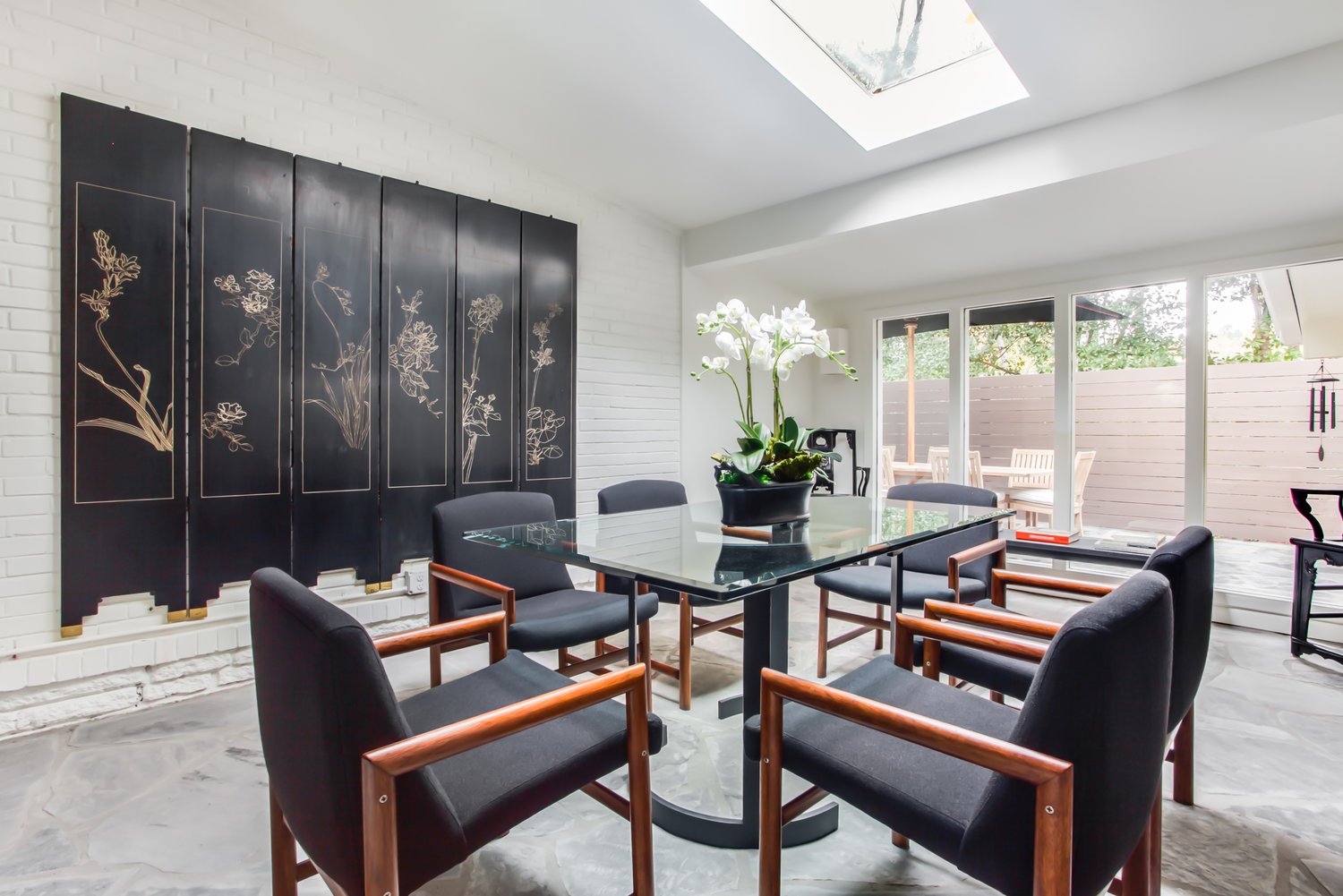 Dining Table, Chairs, and Sliding Doors to the Backyard.