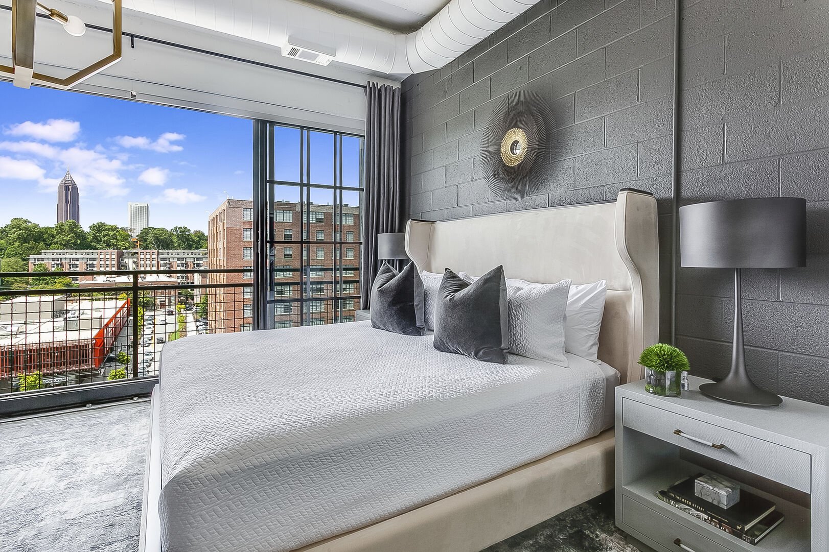 Picture of the sleeping area, complete with large bed and nightstands.