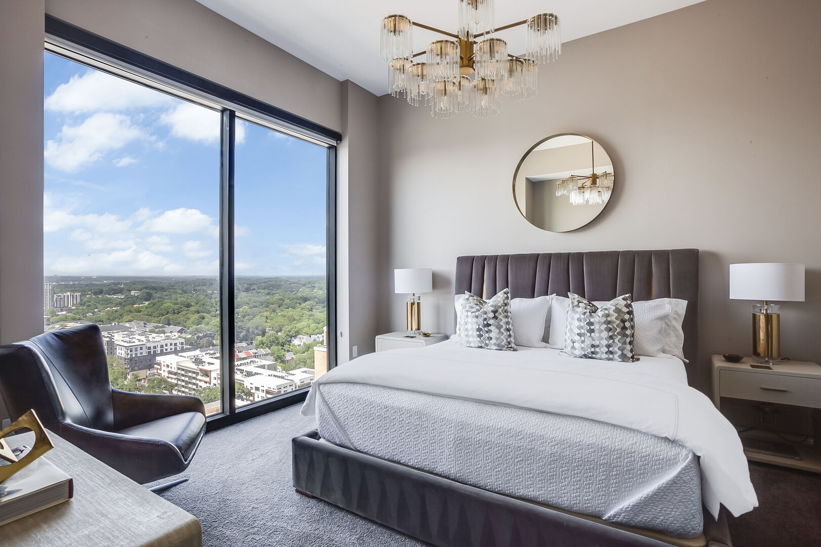 Bedroom with King Bed, Large Windows, and Chair
