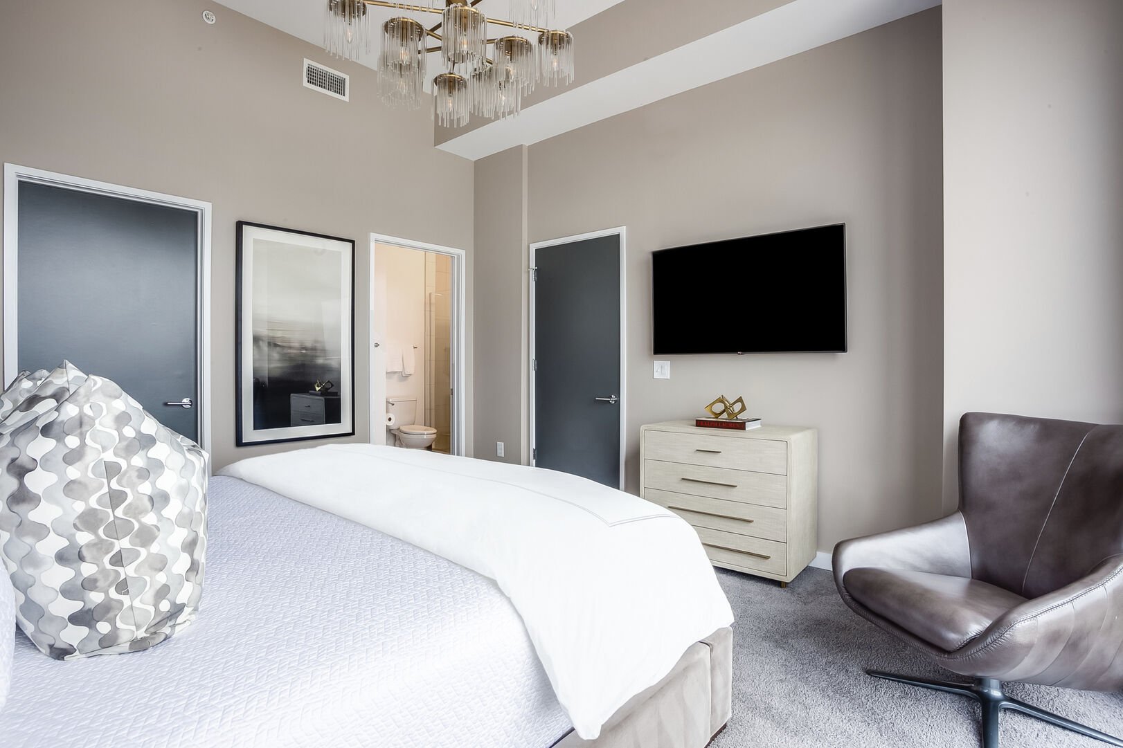 Bedroom with King Bed, TV, and Dresser