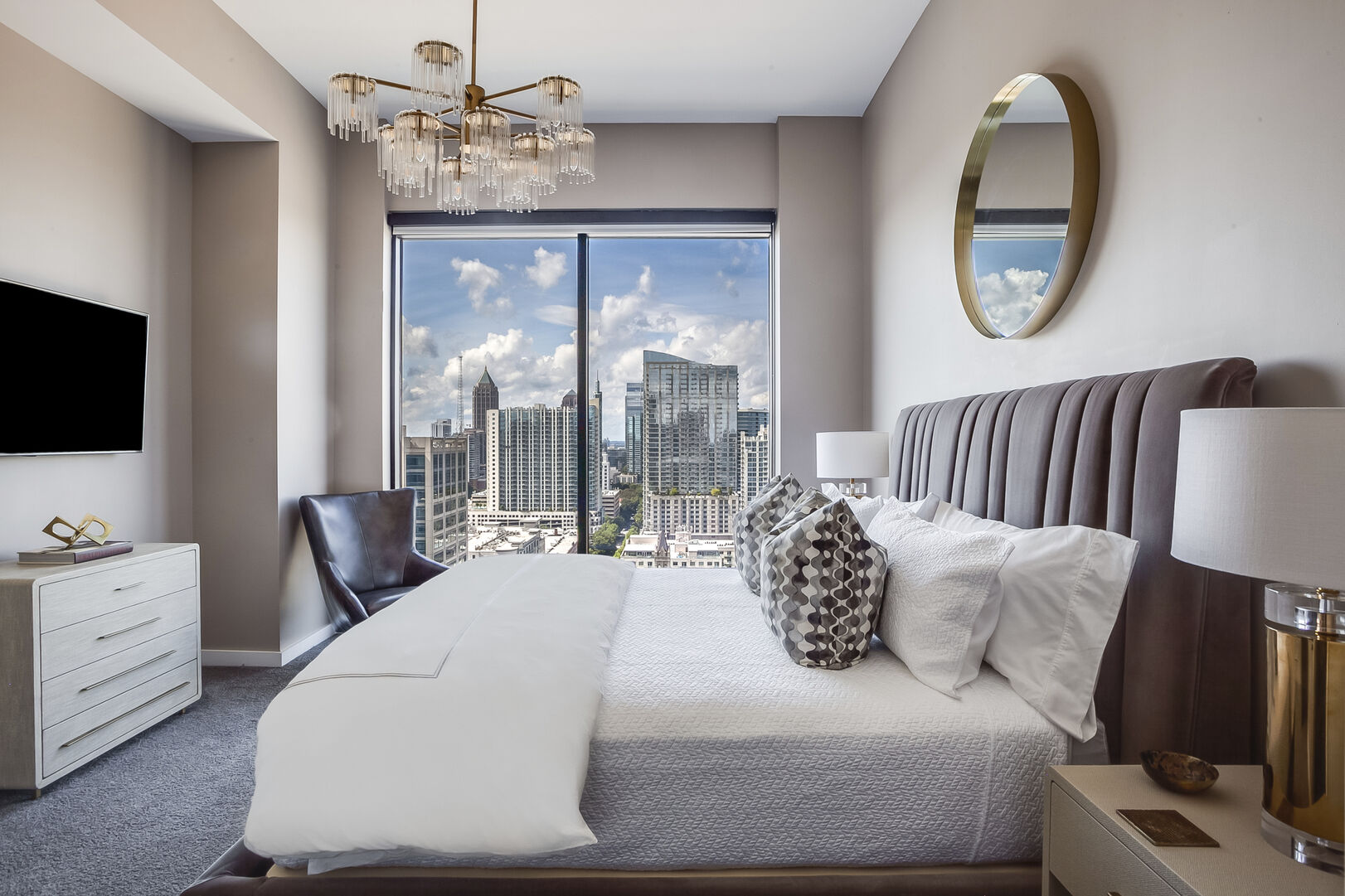 Bedroom with King Bed, Large Windows, TV, and Dresser