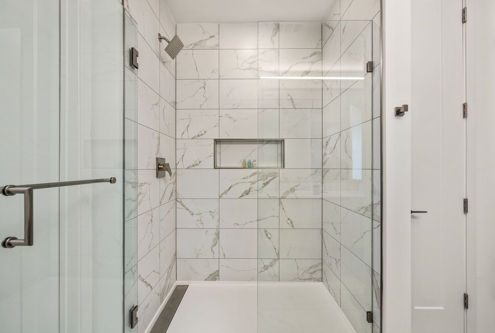 Spacious walk-in shower featuring Molton Brown amenities