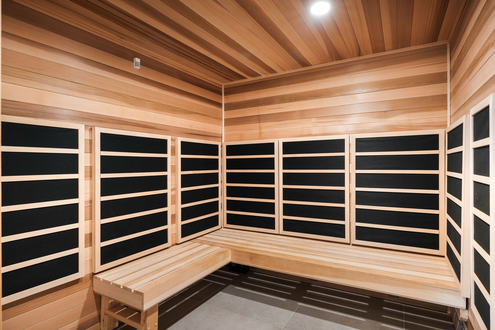 Fitness studio featuring an infered sauna