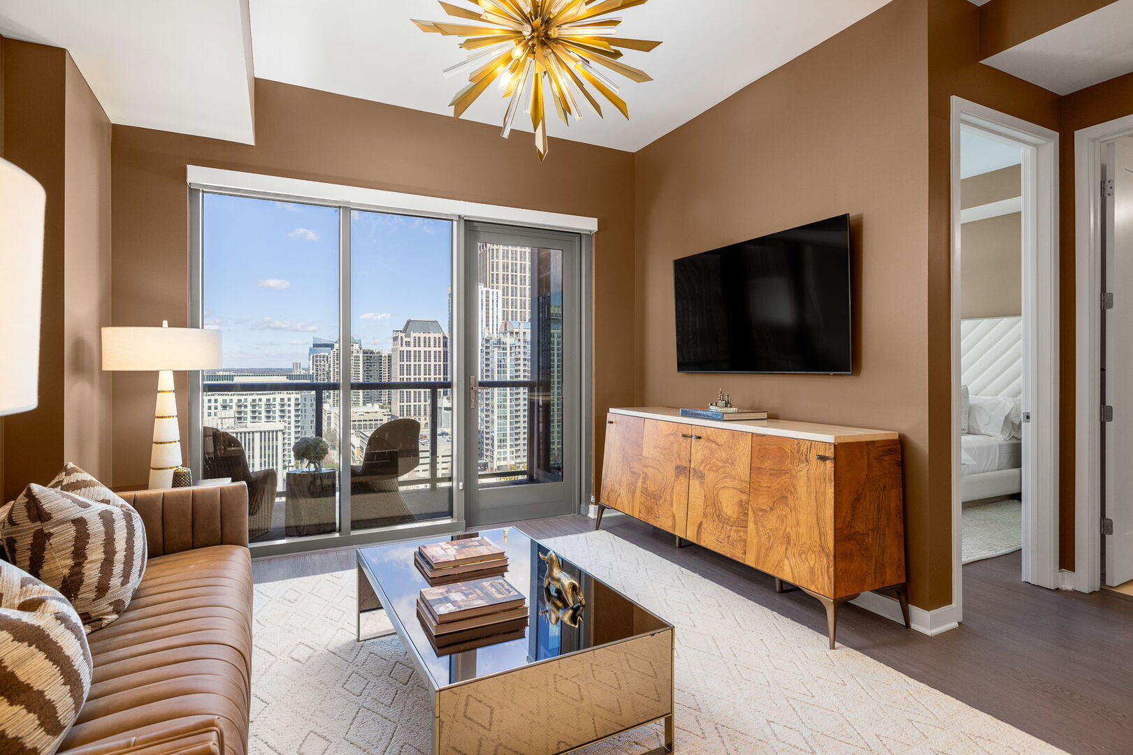 Living room featuring a 65 4K UHD TV