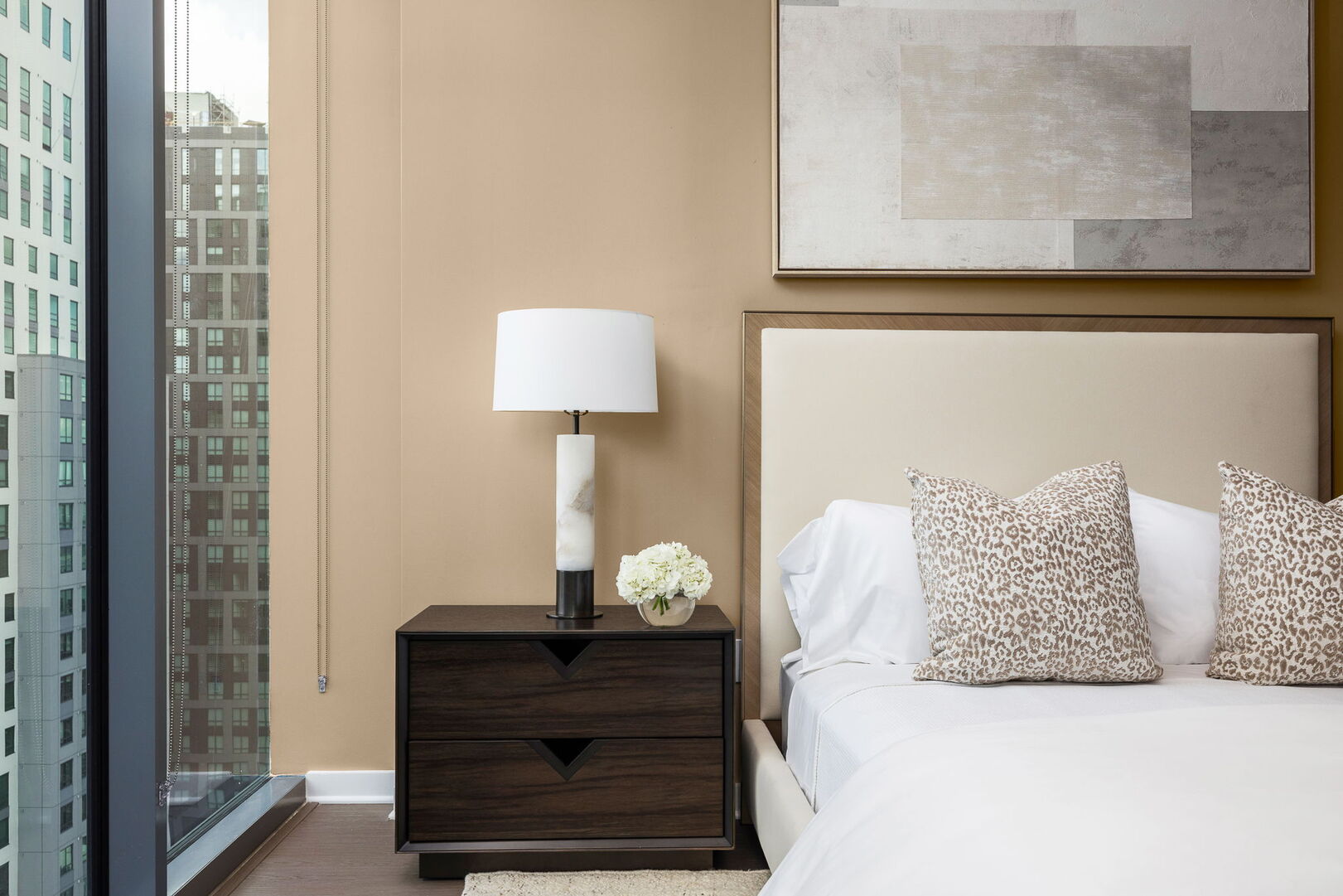 Primary suite with a queen bed and a 55 4K UHD TV