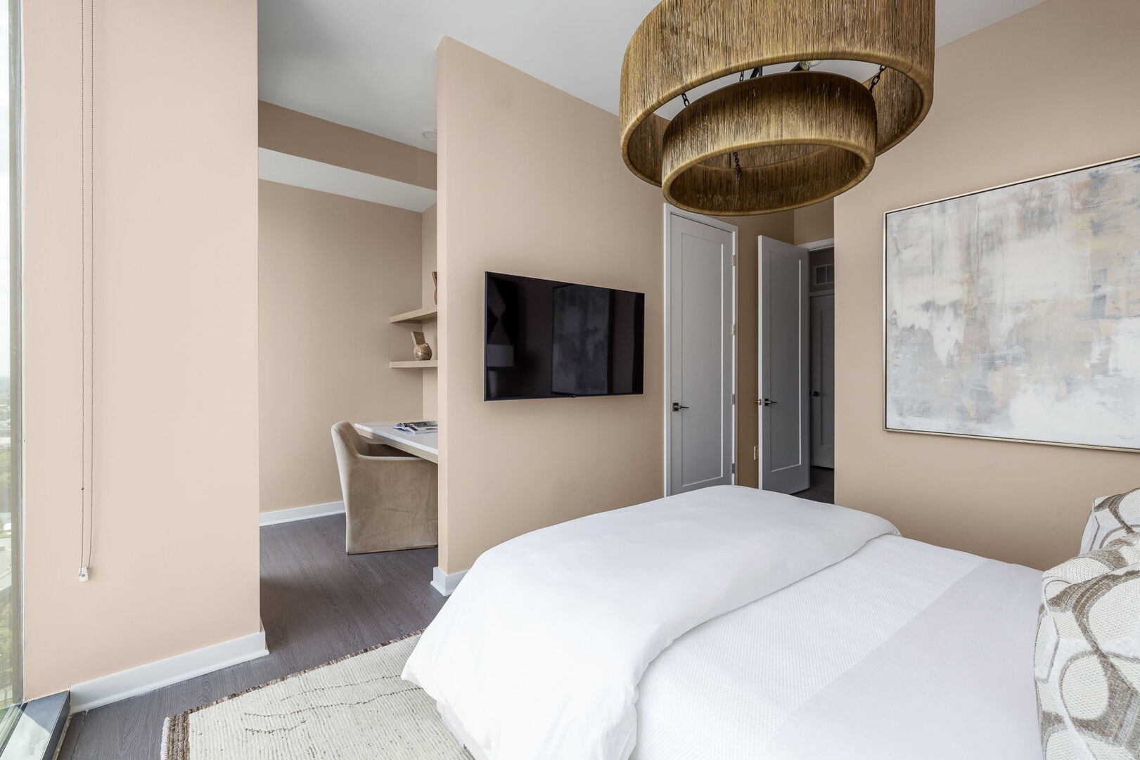 Secondary suite with a queen bed and a 55 Secondary suite with a queen bed and a 55