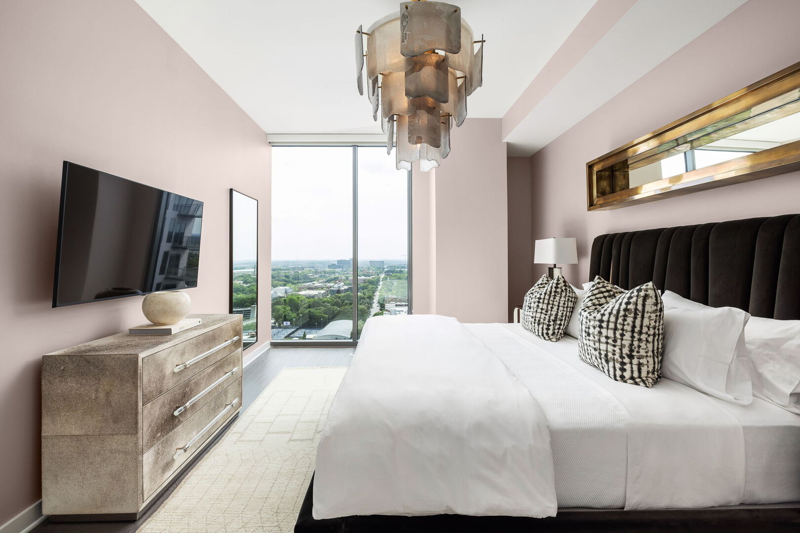 Primary suite with a king bed and a 55 Primary suite with a king bed and a 55