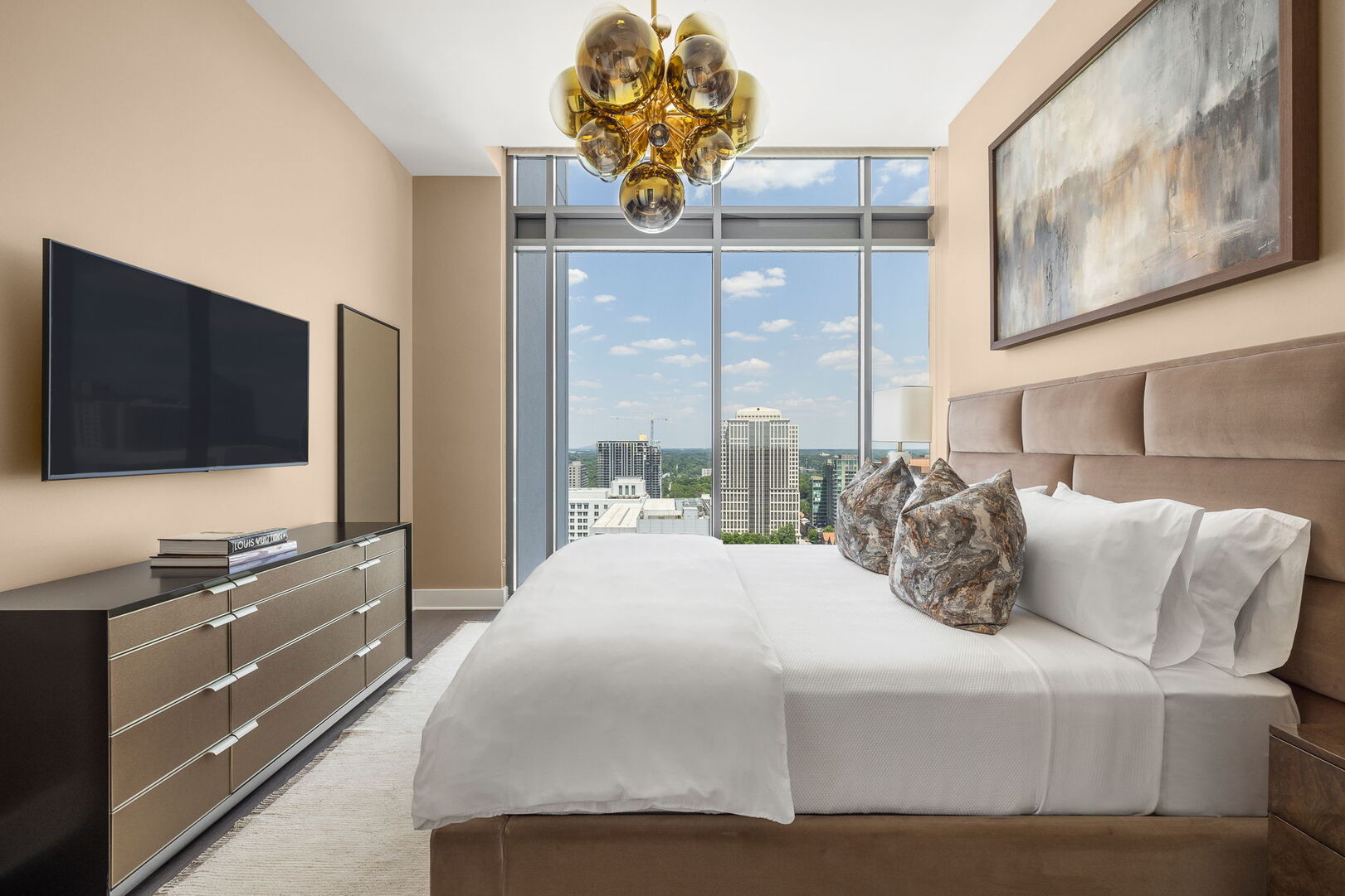 Primary suite with a king bed and a 55 Primary suite with a king bed and a 55