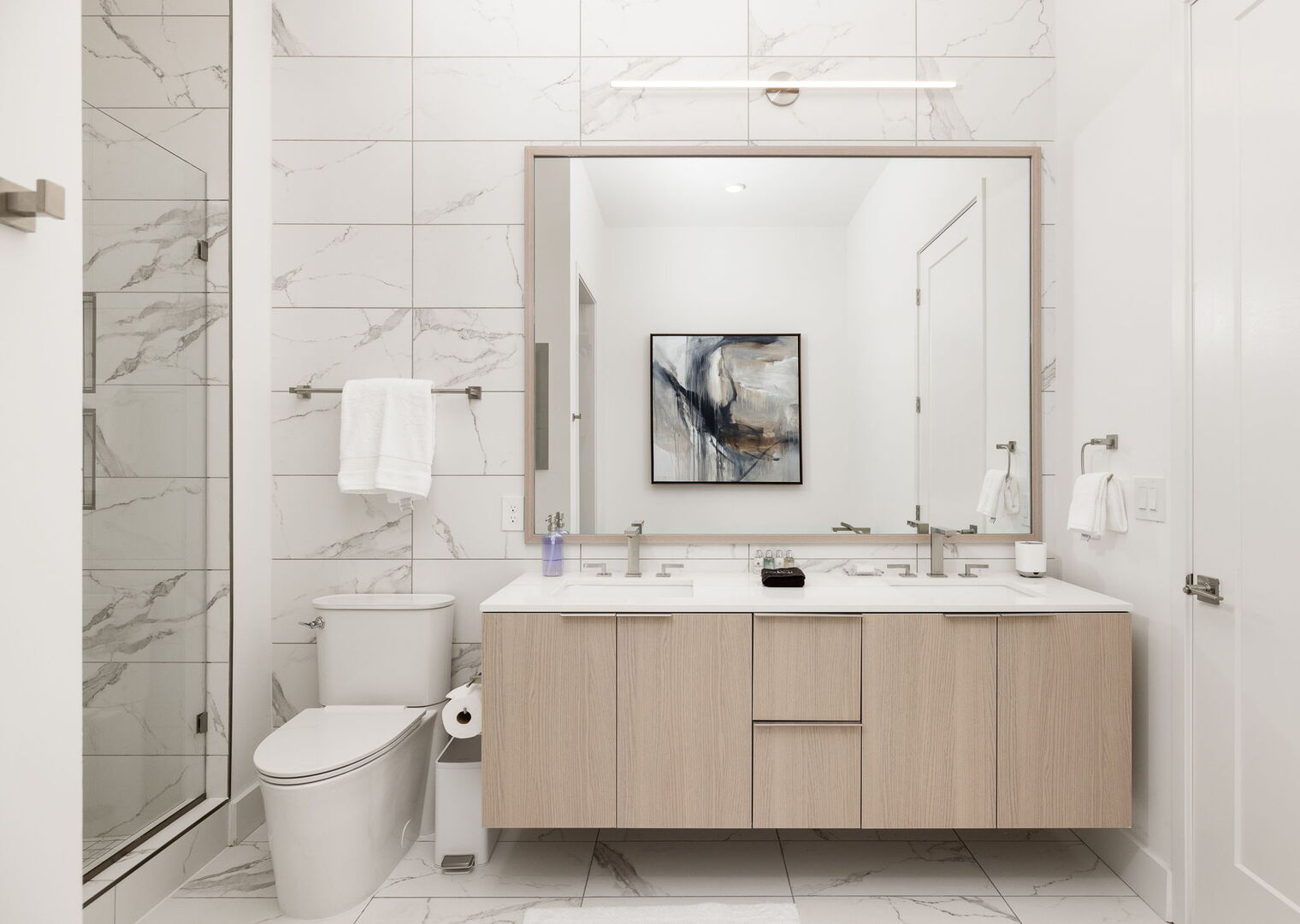 An en-suite bathroom featuring a double vanity and a spacious walk-in shower and a tub An en-suite bathroom featuring a double vanity and a spacious walk-in shower and a tub
