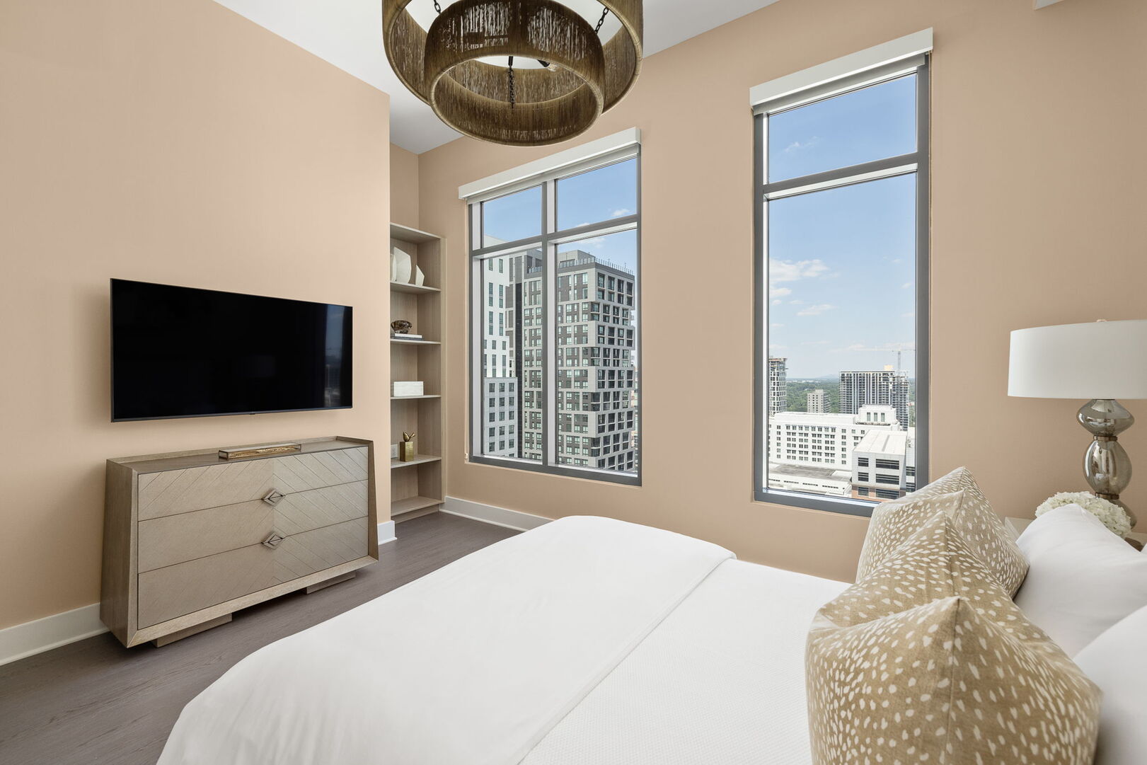 Guest suite with a queen bed and a 55 Guest suite with a queen bed and a 55