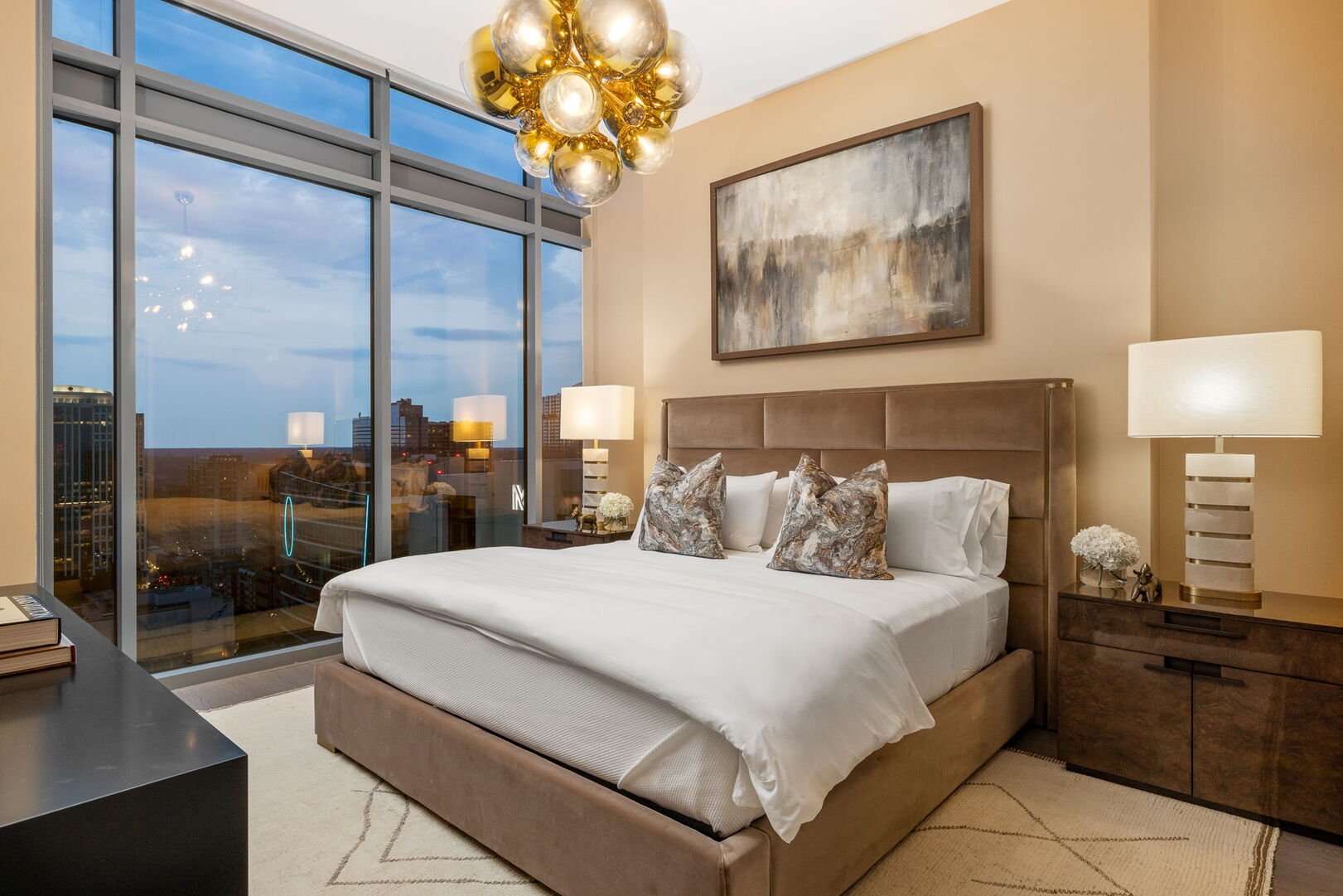 Primary suite with a king bed and a 55 Primary suite with a king bed and a 55