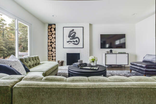 Window, Sectional Sofa, Coffee Table, Fireplace, Arm Chairs, and TV.