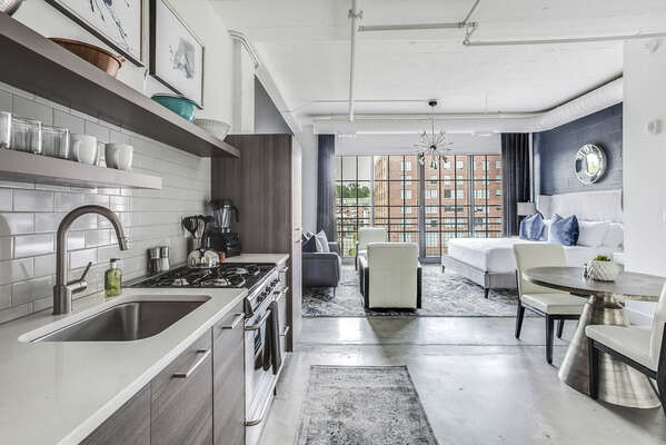 Picture was taken from inside the kitchen with a view of the living area and sleeping area.