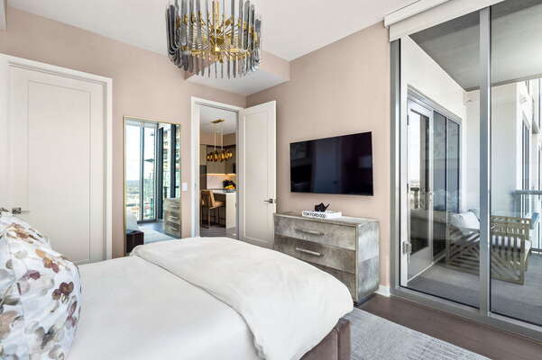 Primary suite with a king bed and a 55 4K UHD TV