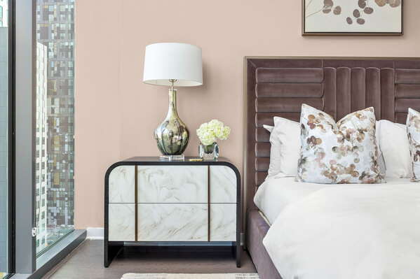 Primary suite with a queen king and a 55 4K UHD TV