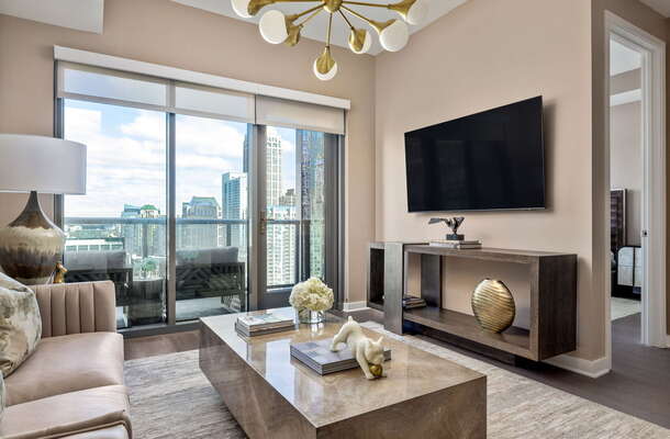 Living room featuring a 65 4K UHD TV