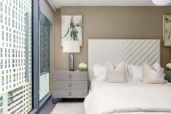 Primary suite with a king bed and a 55 4K UHD TV