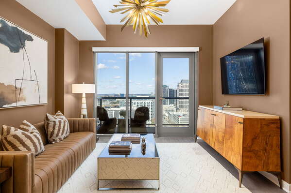 Living room featuring a 65 4K UHD TV