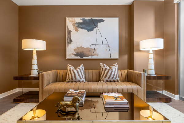 Living room featuring a 65 4K UHD TV