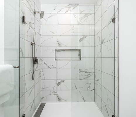 Spacious walk-in shower featuring Molton Brown amenities