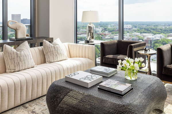 Living room featuring a 65 4K UHD TV