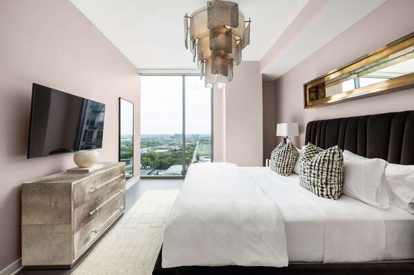 Primary suite with a king bed and a 55 4K UHD TV