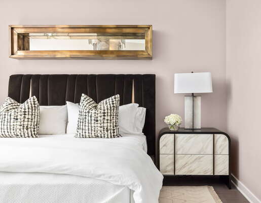 Primary suite with a king bed and a 55 4K UHD TV