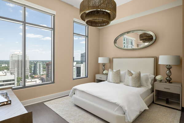 Guest suite with a queen bed and a 55 4K UHD TV