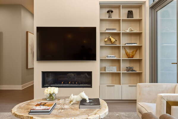 Living room featuring a 65 4K UHD TV