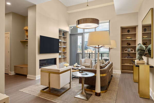 Living room featuring a 65 4K UHD TV