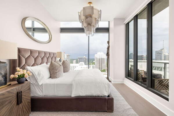 Primary suite with a king bed and a 55 4K UHD TV