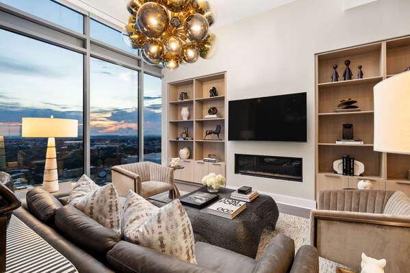 Living room featuring a 65 4K UHD TV